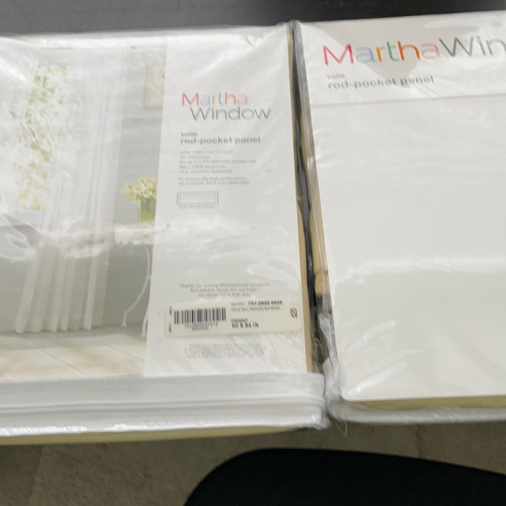 Pair of voile window panels new and unused.